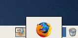 A large Firefox logo being dragged across workspaces